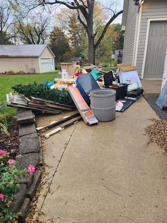 Dumpster being loaded with debris for 3 Yard Dumpster Rental in Palos Verdes Estates